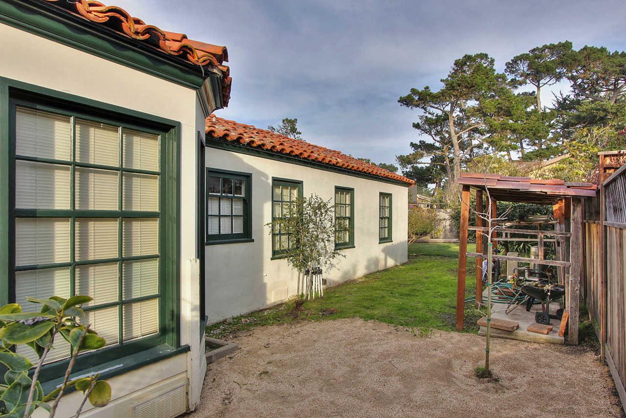 3035 Valdez Road Pebble Beach, CA 93953 - Photo 54 of 60 a backyard of a house with barbeque oven table and chairs