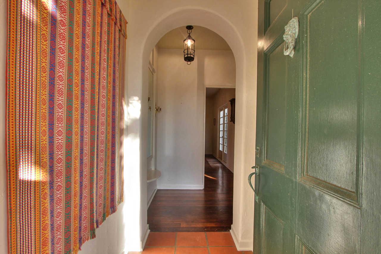 3035 Valdez Road Pebble Beach, CA 93953 - Photo 8 of 60 a view of a hallway with wooden floor and staircase