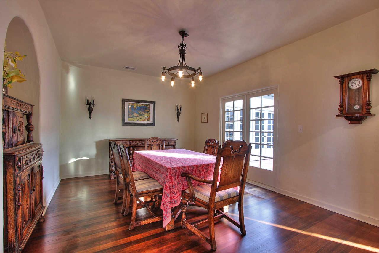 3035 Valdez Road Pebble Beach, CA 93953 - Photo 9 of 60 a dining room with furniture a chandelier and wooden floor