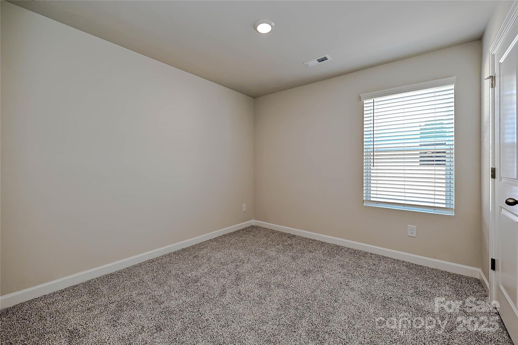 1313 30th St Lane Northeast Conover, NC 28613 - Photo 23 of 27 an empty room with a window
