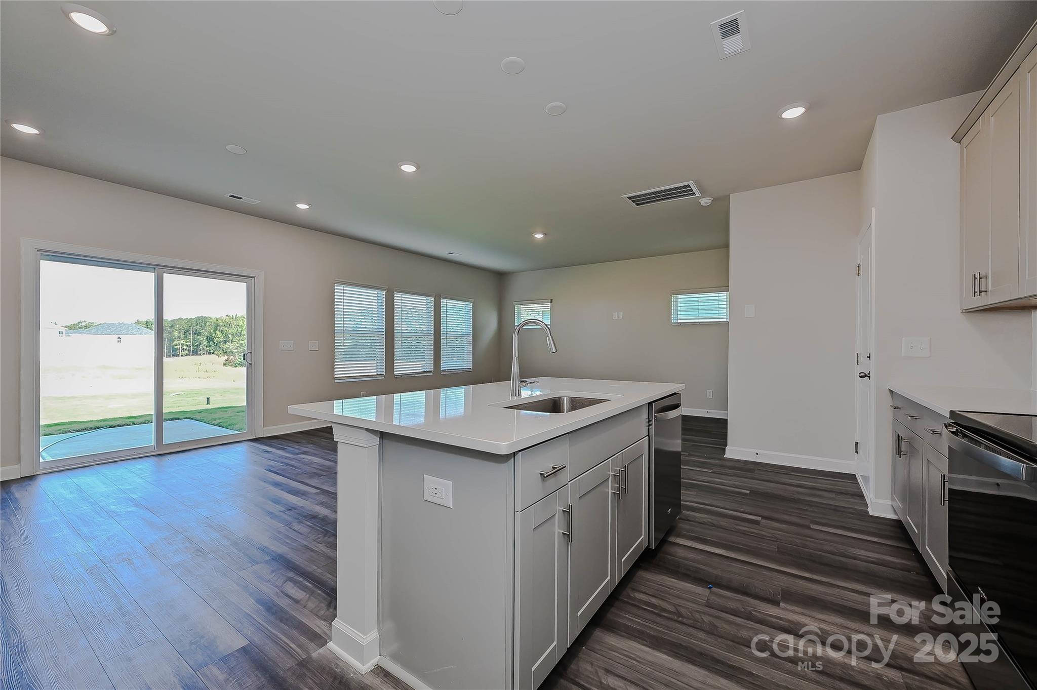 1313 30th St Lane Northeast Conover, NC 28613 - Photo 9 of 27 a kitchen with granite countertop a stove and a sink
