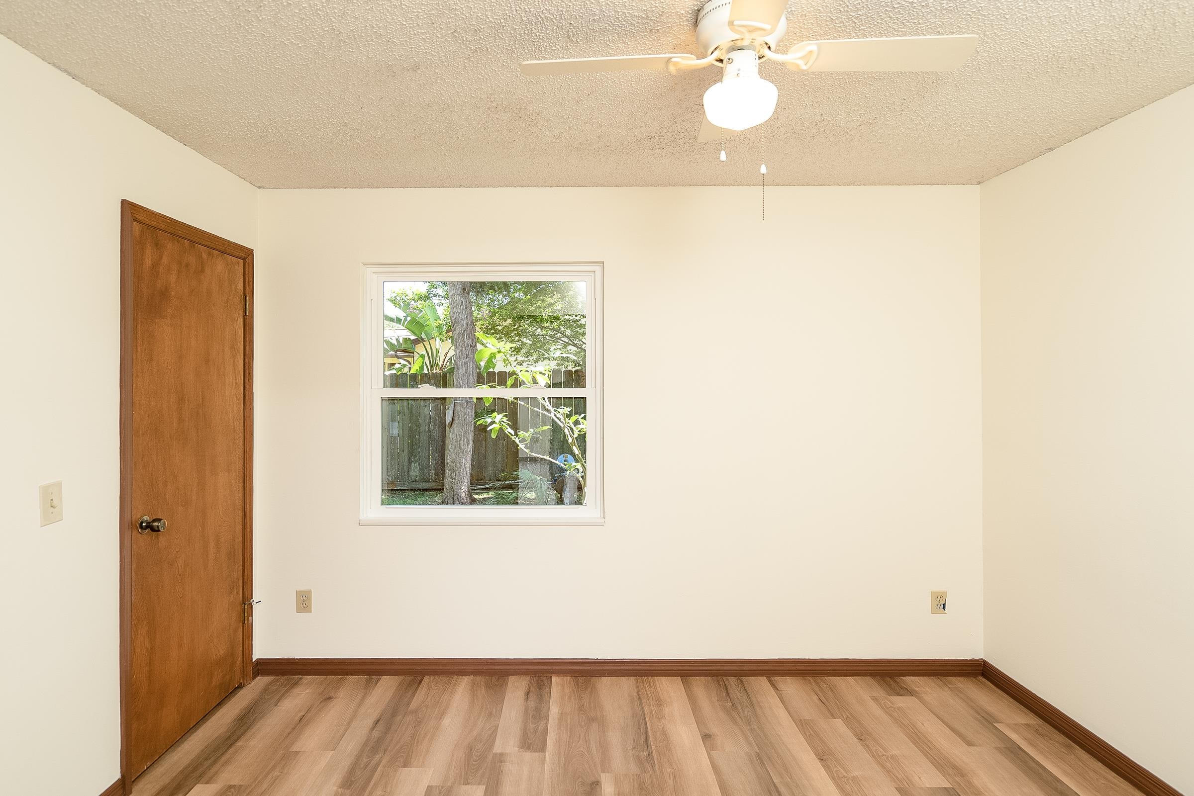 328 Linden Road St. Augustine, FL 32086 - Photo 45 of 62 a view of an empty room with wooden floor and a window