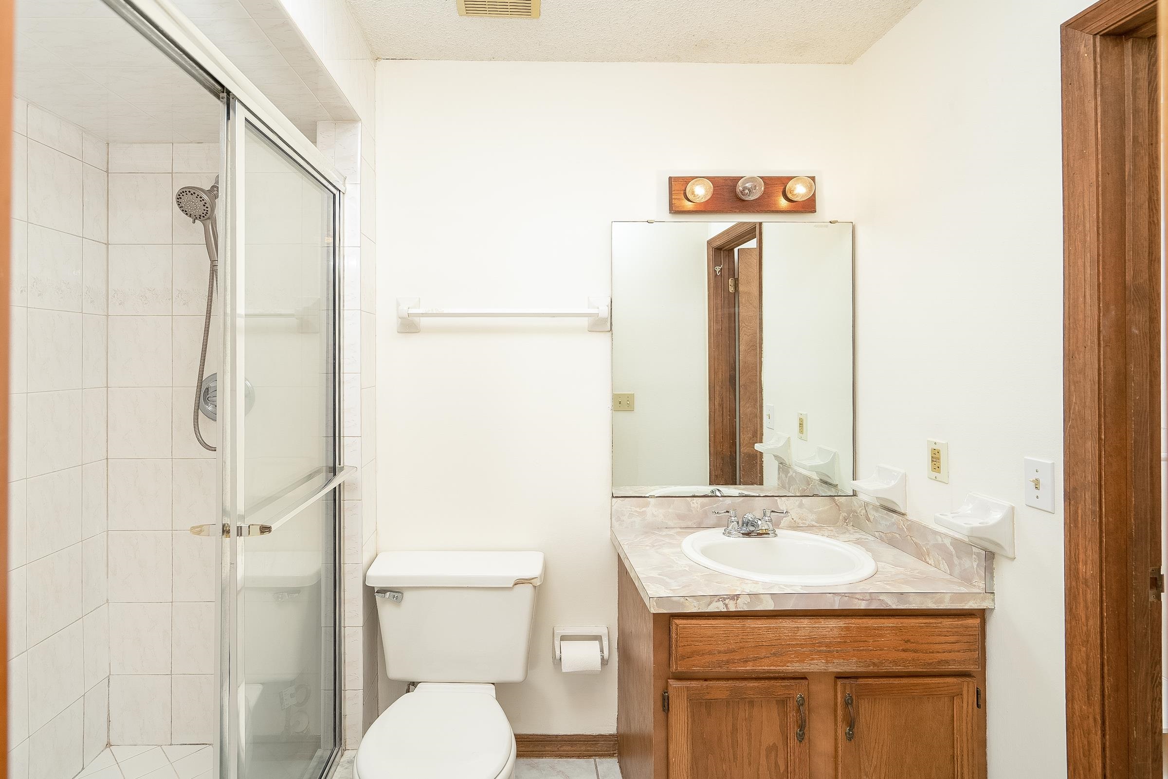328 Linden Road St. Augustine, FL 32086 - Photo 60 of 62 a bathroom with a sink toilet and shower