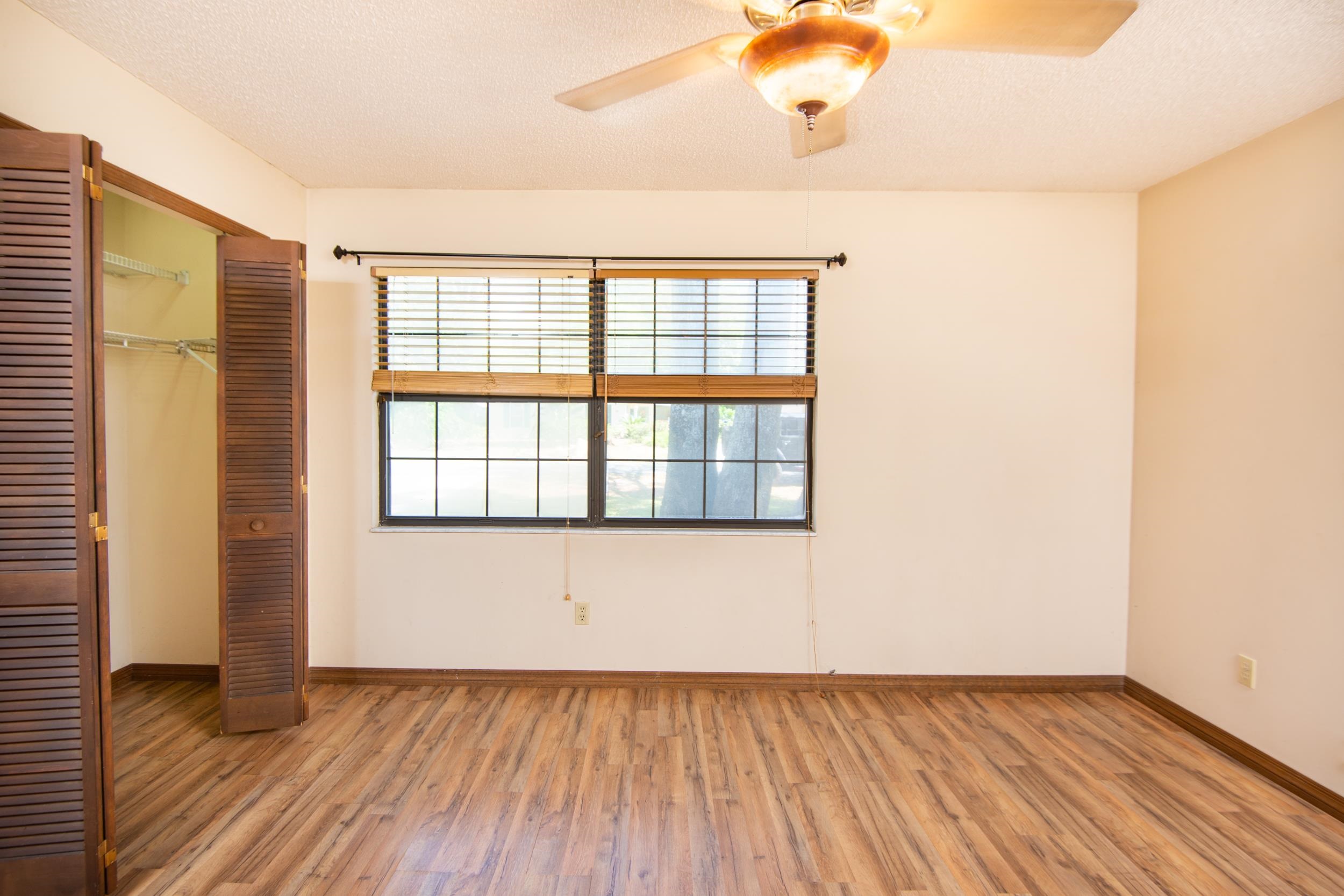 328 Linden Road St. Augustine, FL 32086 - Photo 8 of 62 a view of an empty room with wooden floor and a window