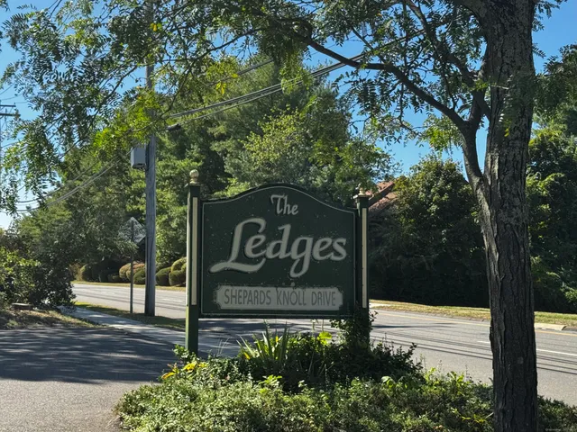 a sign that is on the side of a road