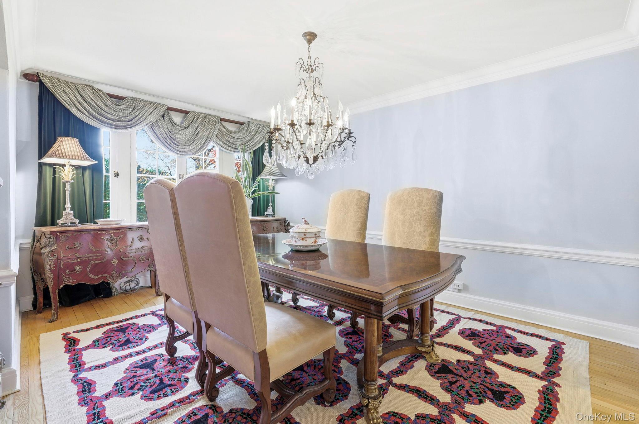 10 Brooklands, Unit 1H Bronxville, NY 10708 - Photo 11 of 33 a view of a dining room with furniture and chandelier