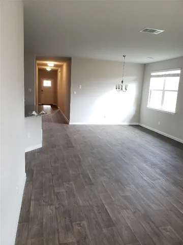 a kitchen with a refrigerator and a sink
