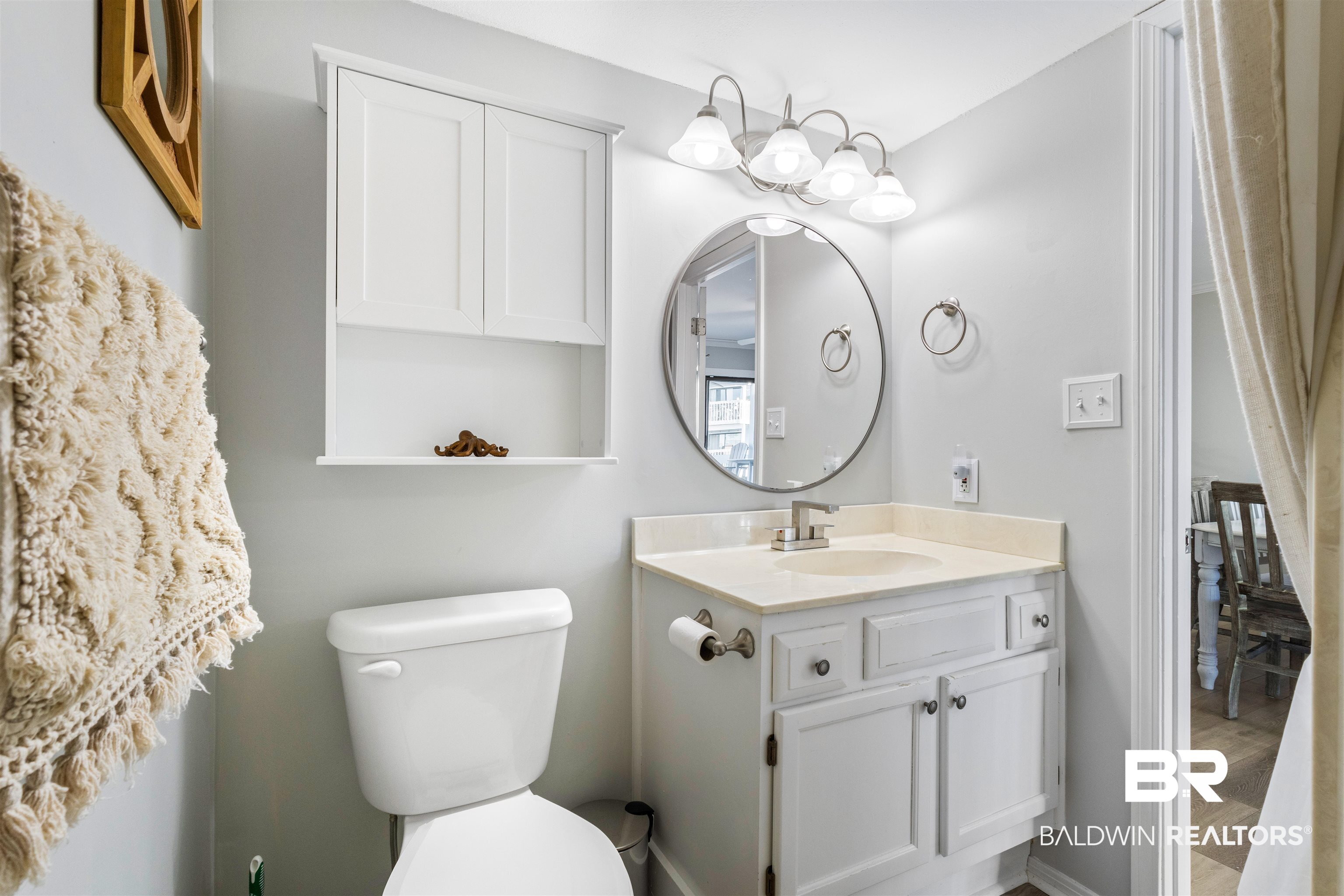 25861 Canal Road, Unit 3 Orange Beach, AL 36561 - Photo 18 of 40 Half bath featuring vanity and wood finished floors