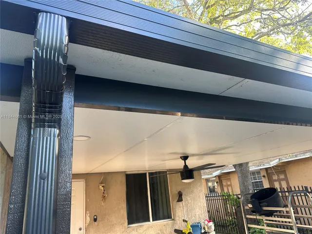 a view of backyard with patio