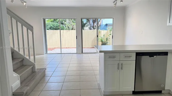 a kitchen with stainless steel appliances cabinets a sink and a stove