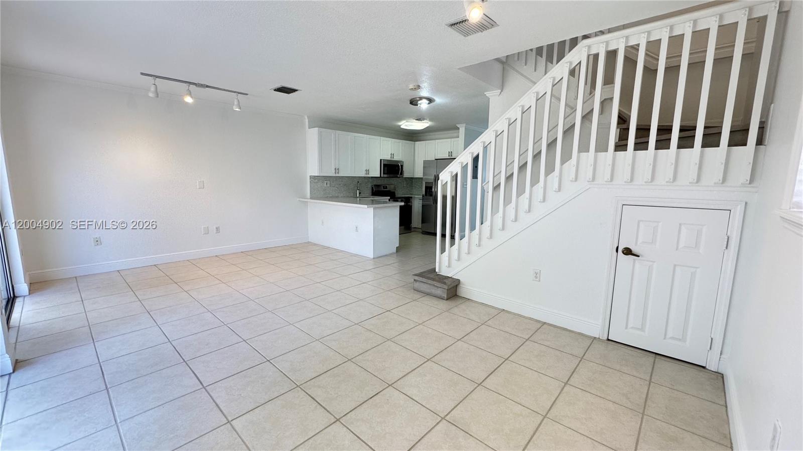 9465 Southwest 77th Court Miami, FL 33156 - Photo 5 of 25 a view of entryway with wooden floor