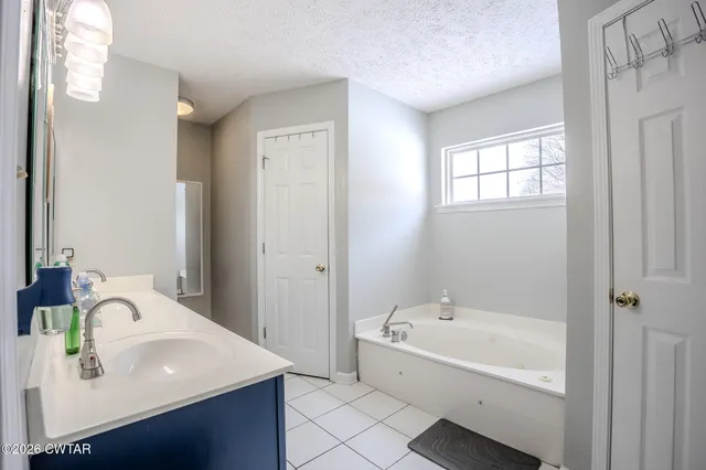 a bathroom with a sink and a bathtub