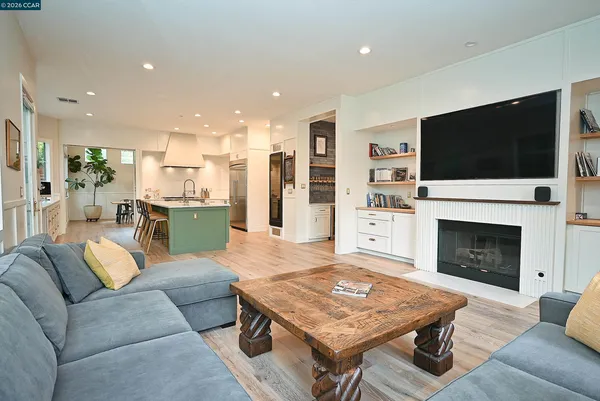 a kitchen with a sink and wooden cabinets