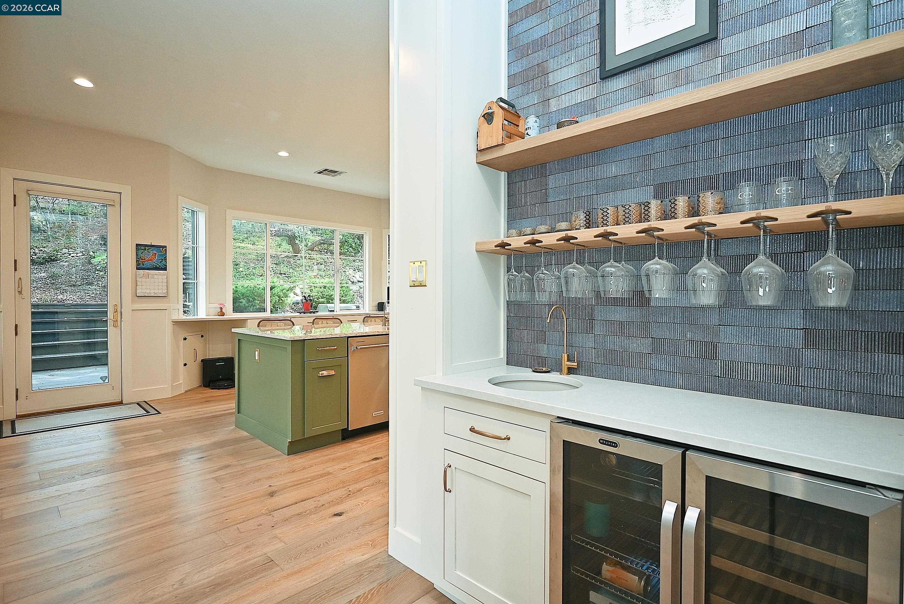 1239 Sunrise Ridge Drive Lafayette, CA 94549 - Photo 19 of 59 a kitchen with a sink and wooden cabinets