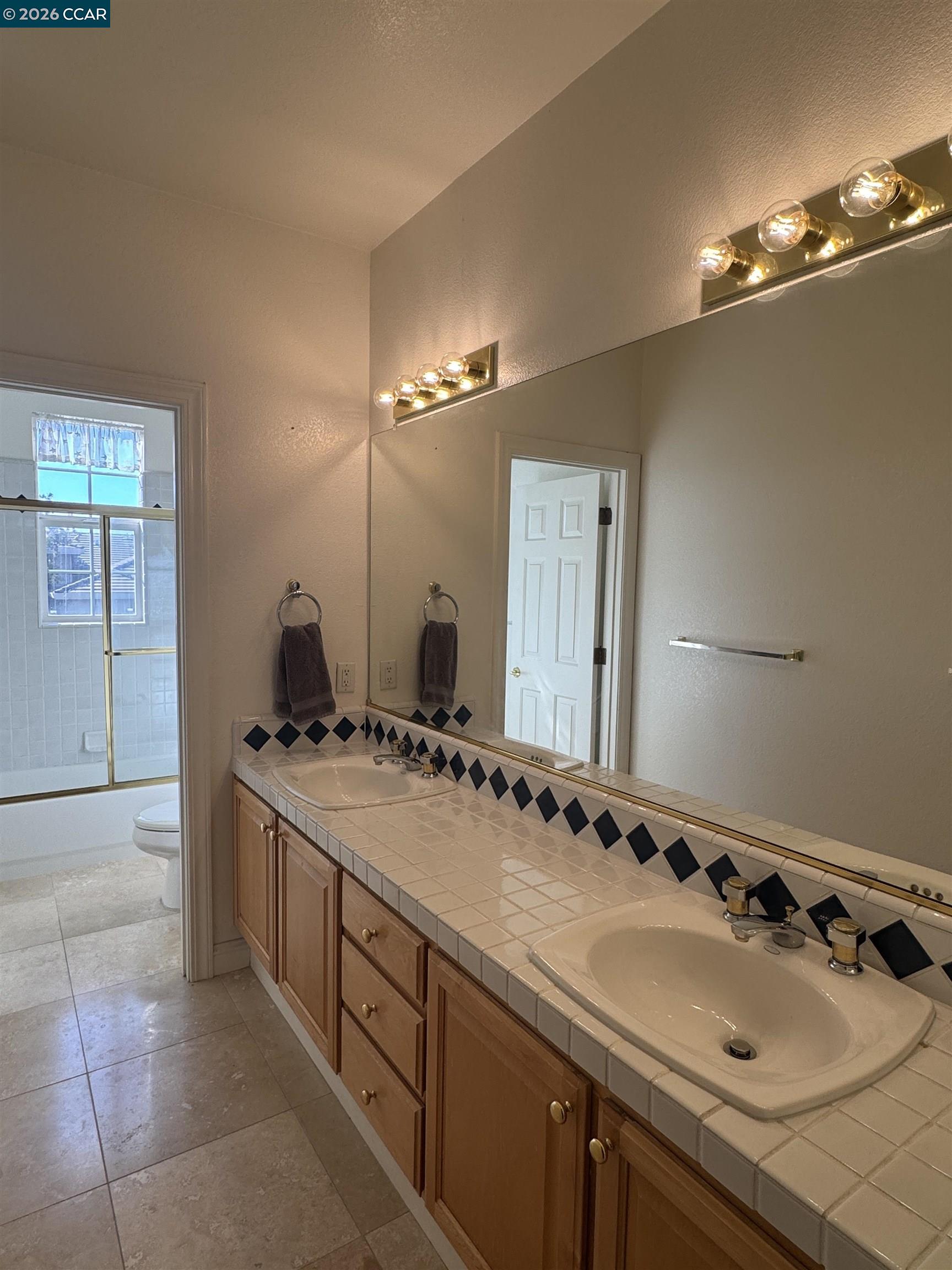 1239 Sunrise Ridge Drive Lafayette, CA 94549 - Photo 22 of 59 a bathroom with a sink and a mirror