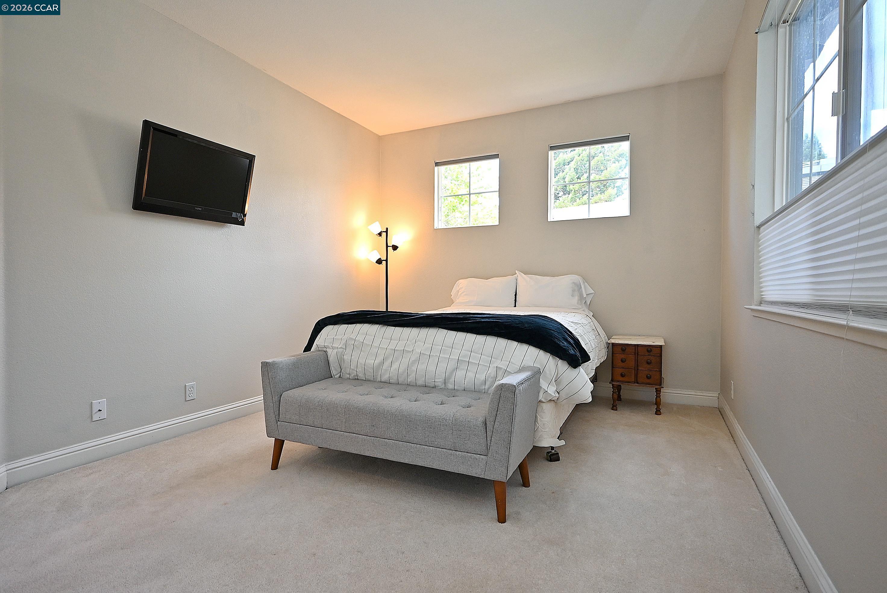 1239 Sunrise Ridge Drive Lafayette, CA 94549 - Photo 25 of 59 a bedroom with a bed and a flat screen tv