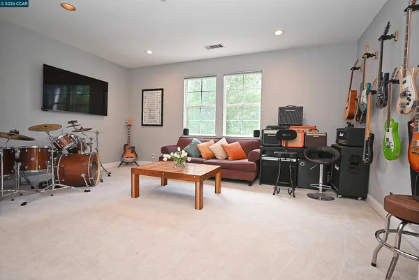 a view of a room that has a bed and a window