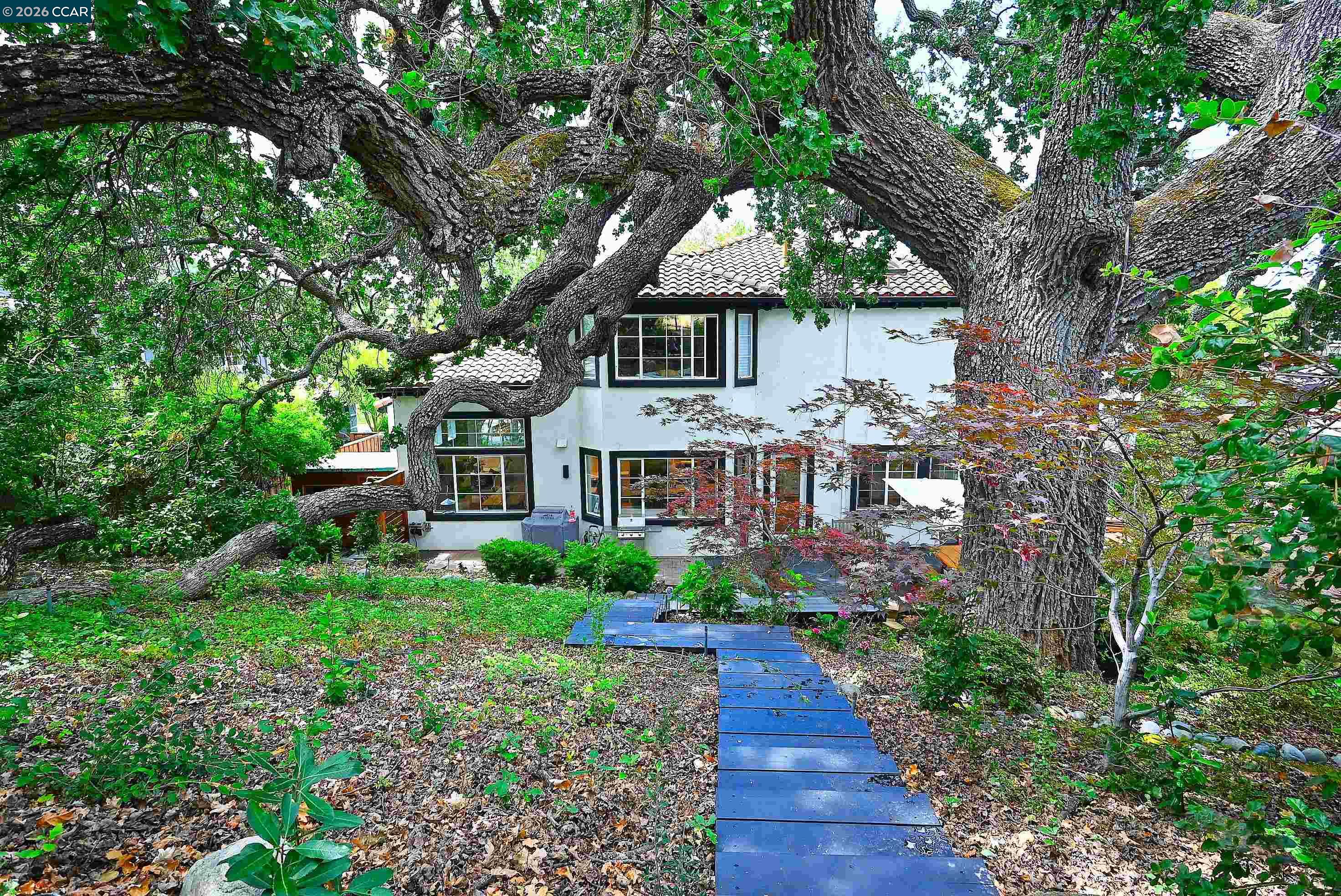 1239 Sunrise Ridge Drive Lafayette, CA 94549 - Photo 43 of 59 a front view of a house with a yard