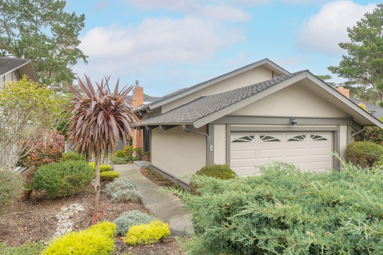 4 Country Club Gate, Unit 2 Pacific Grove, CA 93950 - Photo 1 of 11 a front view of a house with yard