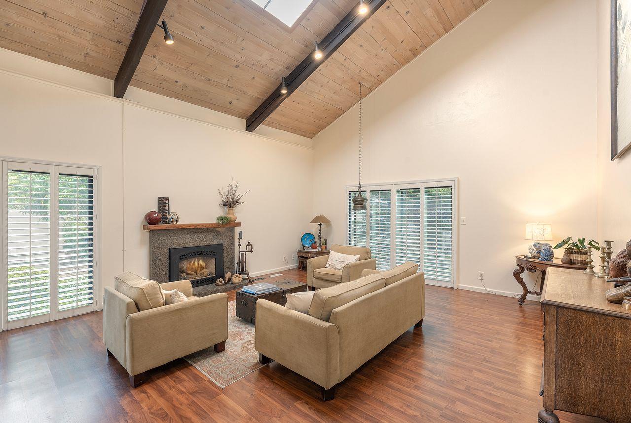 4 Country Club Gate, Unit 2 Pacific Grove, CA 93950 - Photo 6 of 11 a living room with furniture and a fireplace