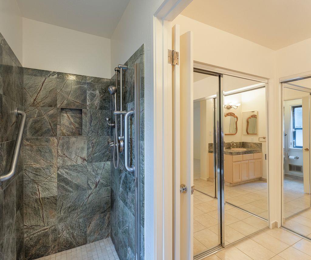 4 Country Club Gate, Unit 2 Pacific Grove, CA 93950 - Photo 9 of 11 a bathroom with a shower and a glass door