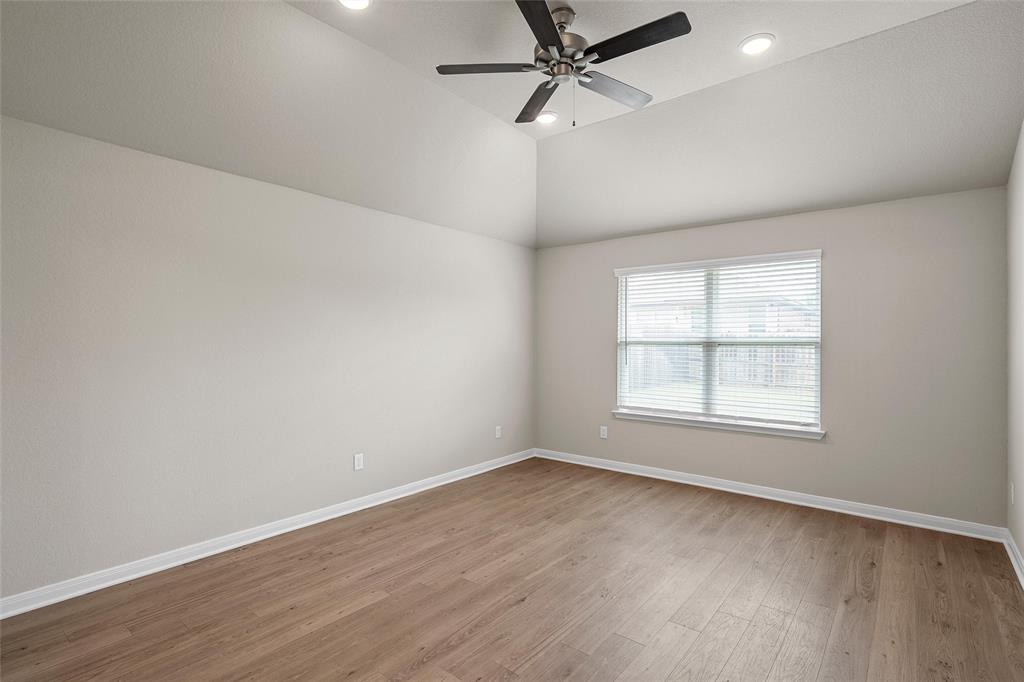 3224 Dottavio Road Lorena, TX 76655 - Photo 20 of 31 an empty room with wooden floor fan and windows