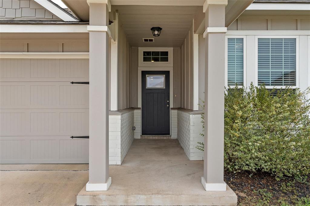 3224 Dottavio Road Lorena, TX 76655 - Photo 2 of 31 a view of a hallway with wooden walls and door
