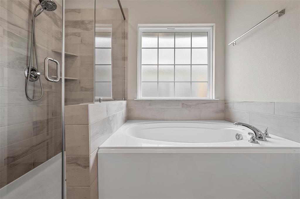 3224 Dottavio Road Lorena, TX 76655 - Photo 24 of 31 a bathroom with a bathtub and shower