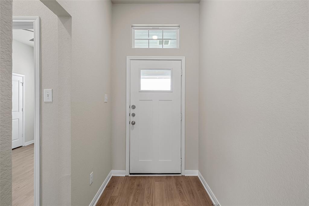 3224 Dottavio Road Lorena, TX 76655 - Photo 3 of 31 a view of a hallway with wooden floor and closet