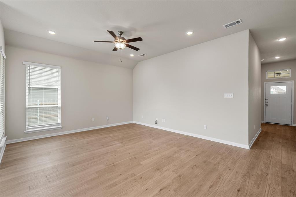 3224 Dottavio Road Lorena, TX 76655 - Photo 5 of 31 wooden floor in an empty room with a window