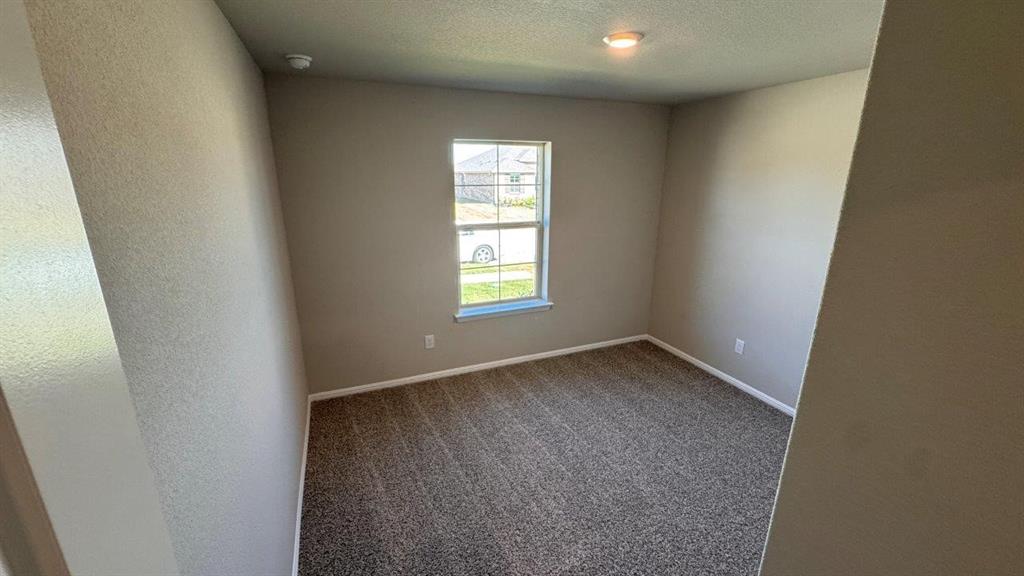 549 Marsh Street Cleburne, TX 76033 - Photo 13 of 20 an empty room with a window