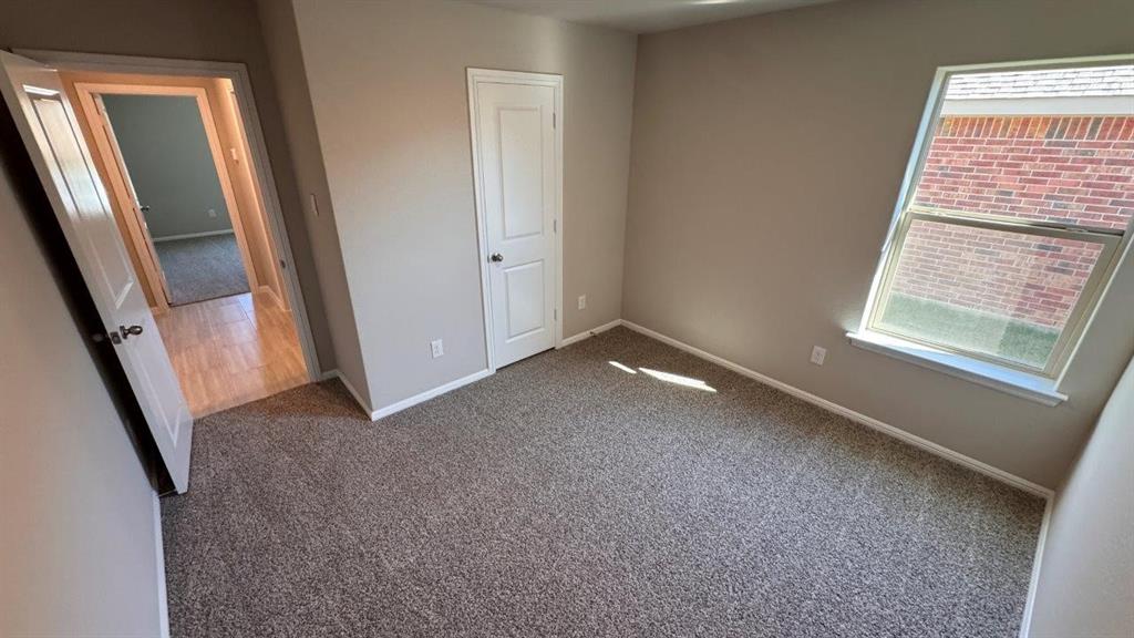549 Marsh Street Cleburne, TX 76033 - Photo 16 of 20 an empty room with window