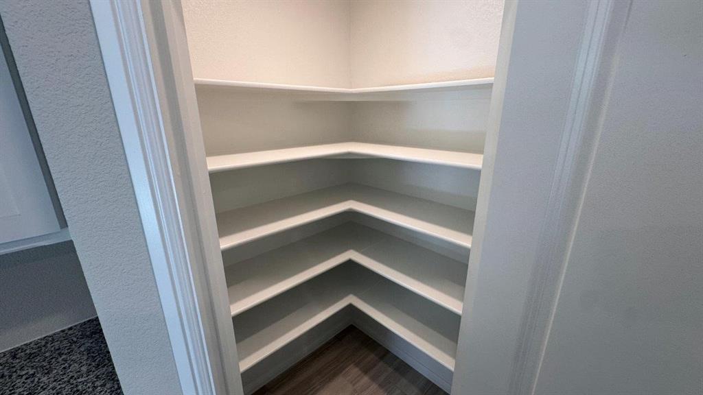 549 Marsh Street Cleburne, TX 76033 - Photo 3 of 20 a view of an empty walk in closet
