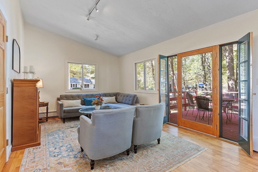 44 Hamlin Street Lunenburg, MA 01462 - Photo 23 of 35 a living room with furniture and a floor to ceiling window