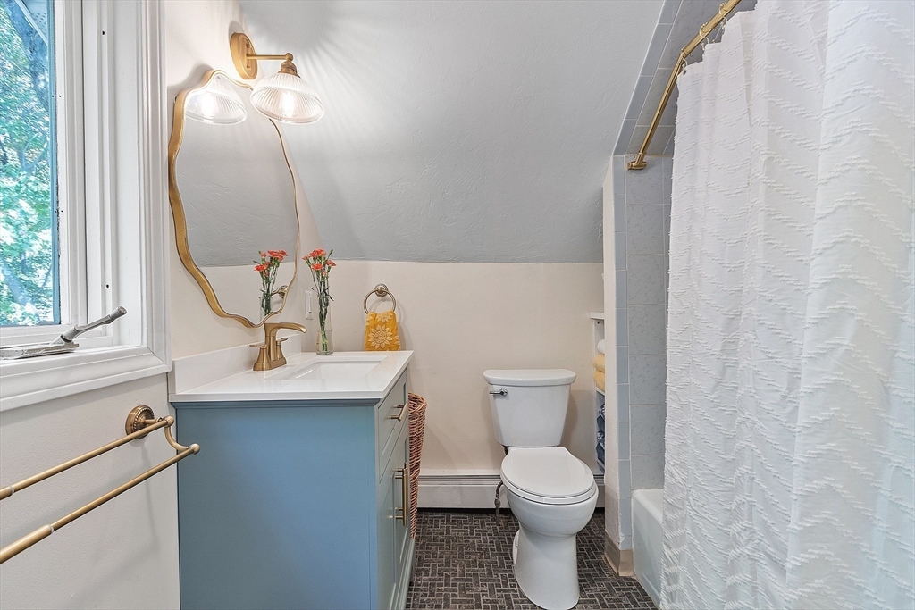 44 Hamlin Street Lunenburg, MA 01462 - Photo 29 of 35 a bathroom with a sink a toilet and mirror
