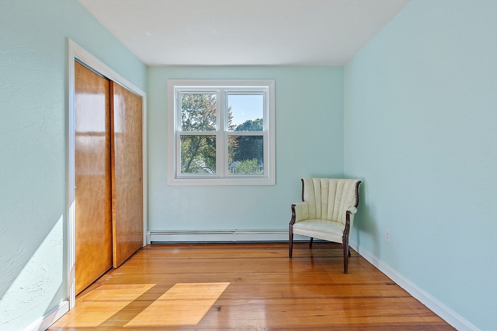 44 Hamlin Street Lunenburg, MA 01462 - Photo 31 of 35 a view of a room with wooden floor lounge chair and windows