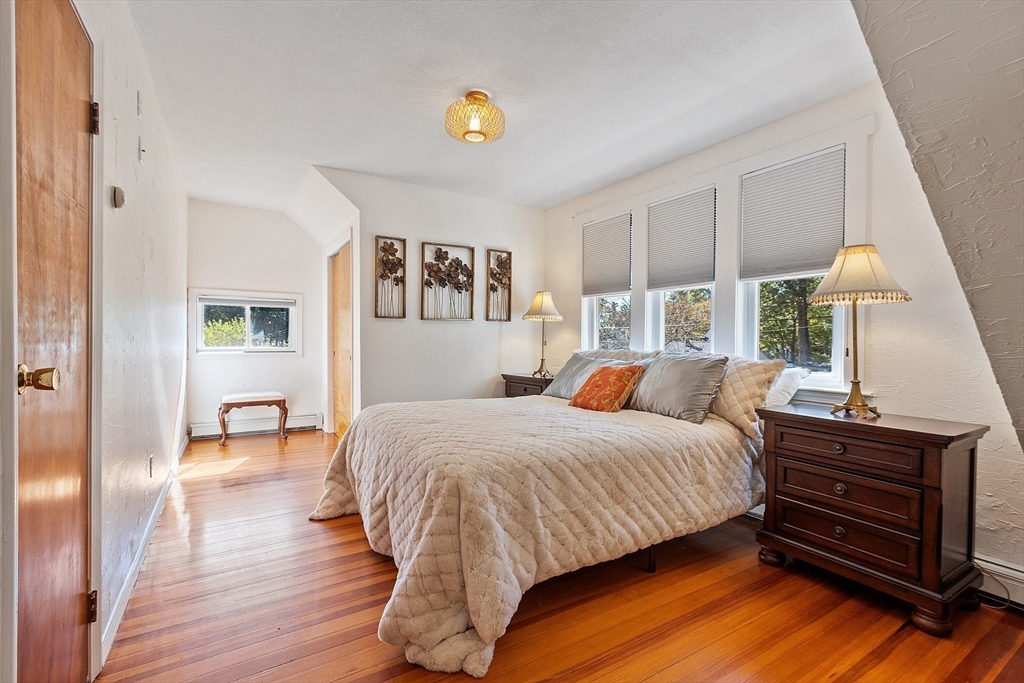 44 Hamlin Street Lunenburg, MA 01462 - Photo 33 of 35 a bedroom with a bed and wooden floor