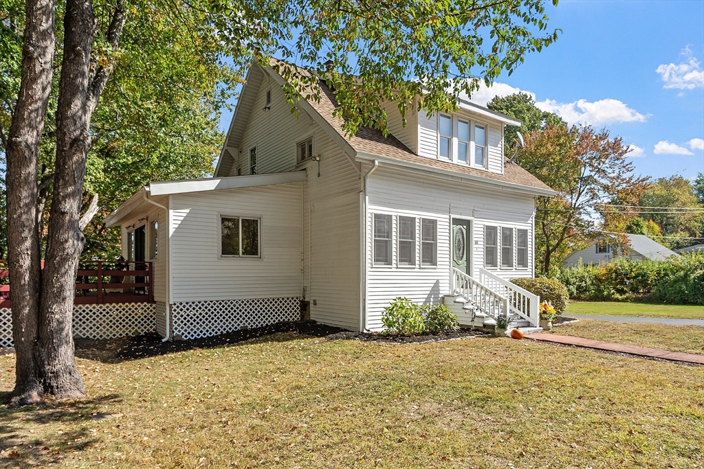 44 Hamlin Street Lunenburg, MA 01462 - Photo 5 of 35 a view of a white house with a yard