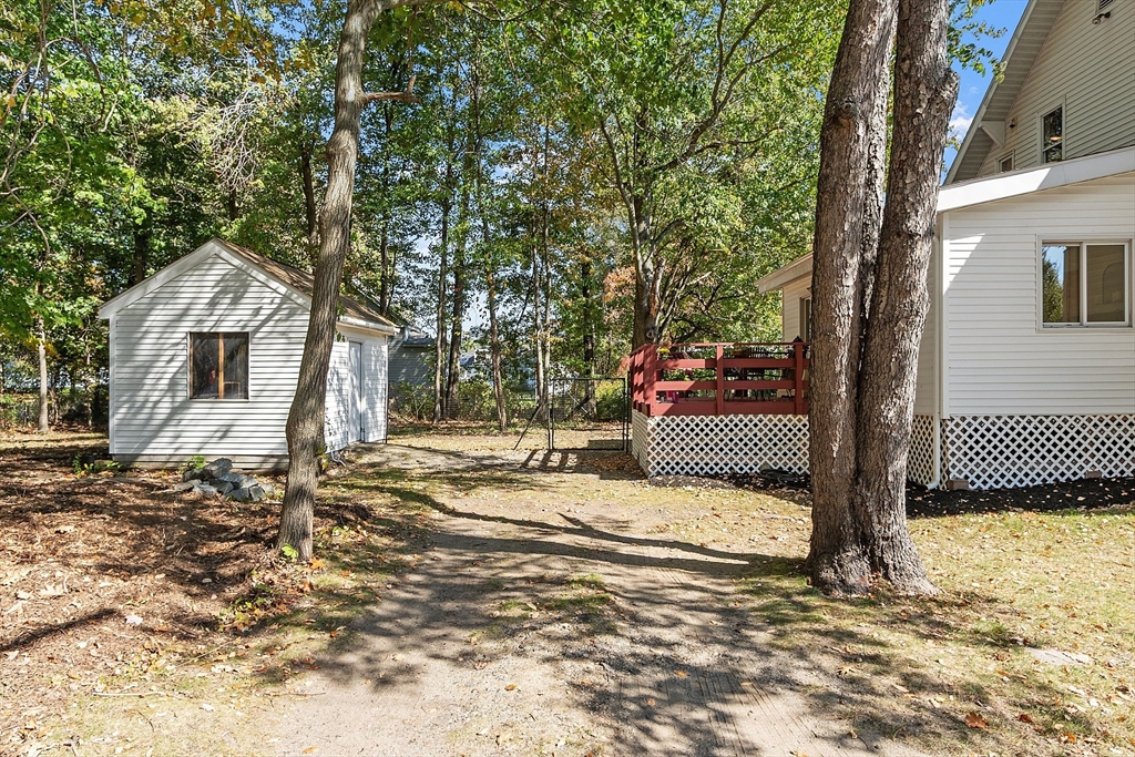44 Hamlin Street Lunenburg, MA 01462 - Photo 6 of 35 a view of a house with a snow on the tree