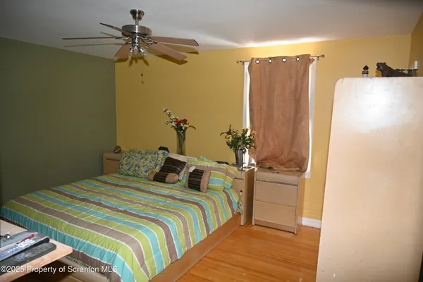 a bedroom with a bed and a dresser