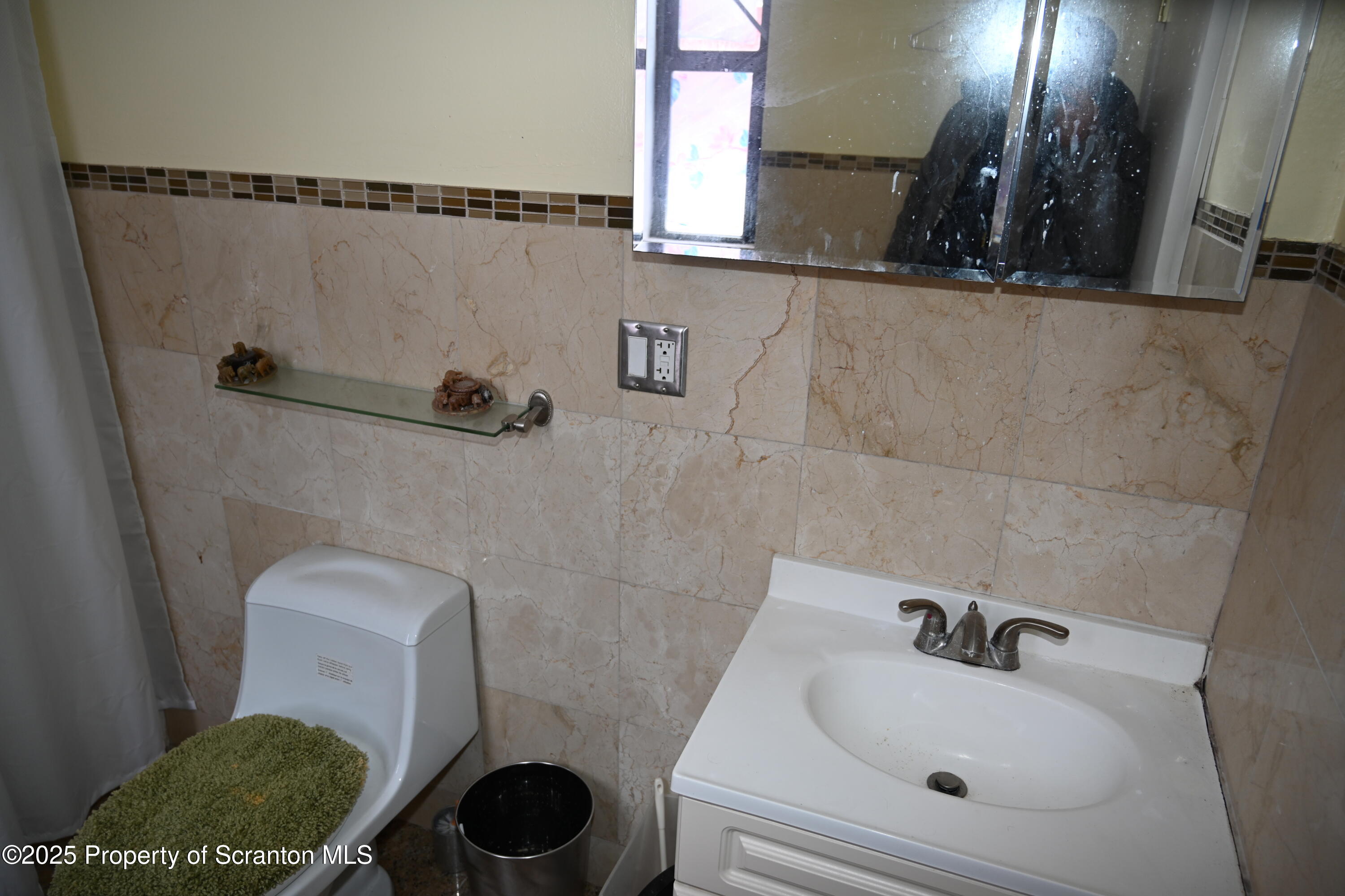 93 Prospect Street Hallstead, PA 18822 - Photo 12 of 32 a bathroom with a sink and a toilet