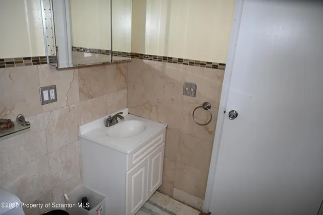 a bathroom with a sink and mirror