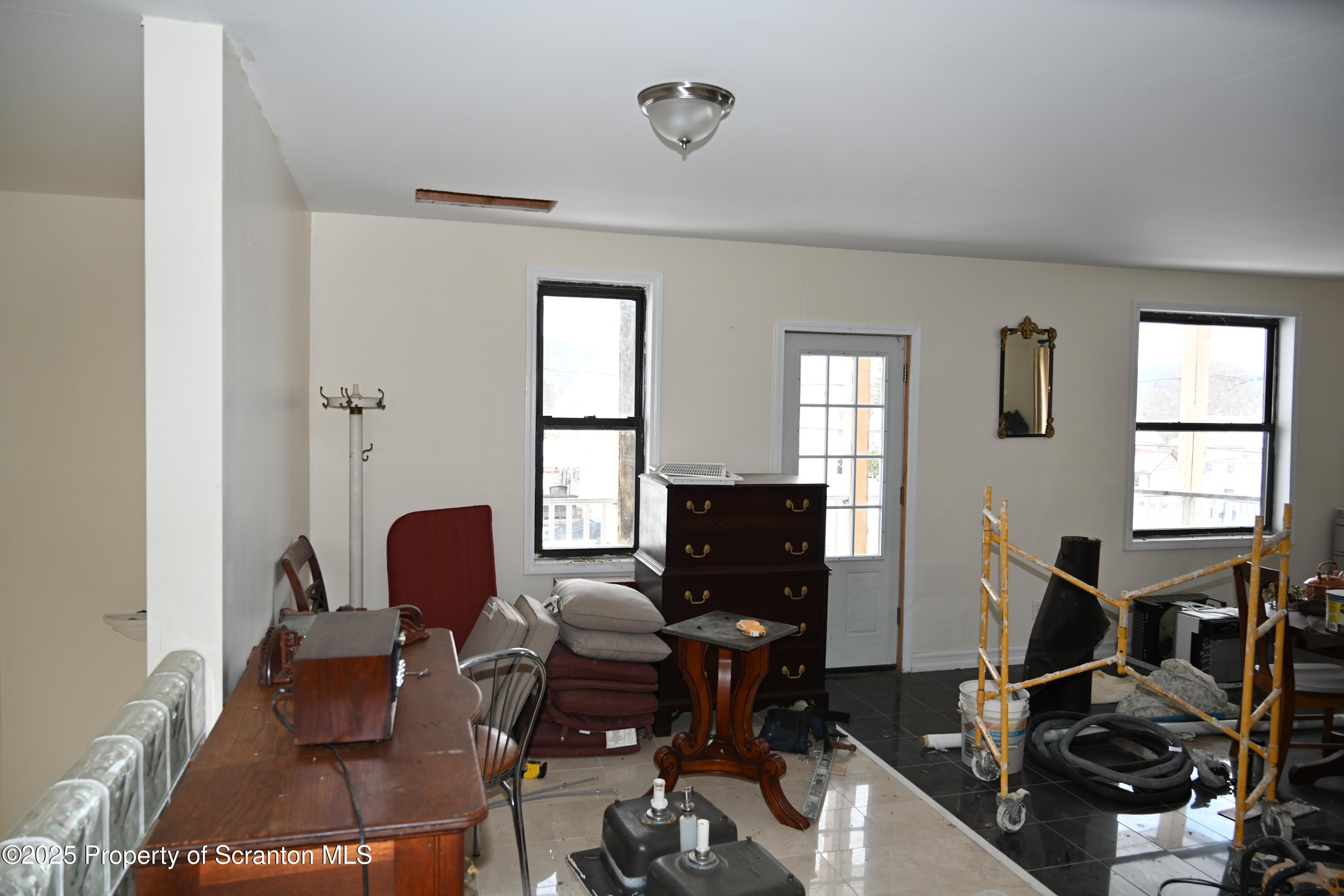 93 Prospect Street Hallstead, PA 18822 - Photo 20 of 32 a living room with furniture chess board and a window