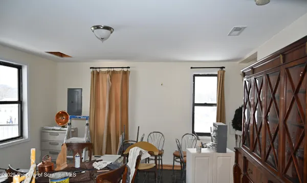 a view of a dining room with furniture window and outside view