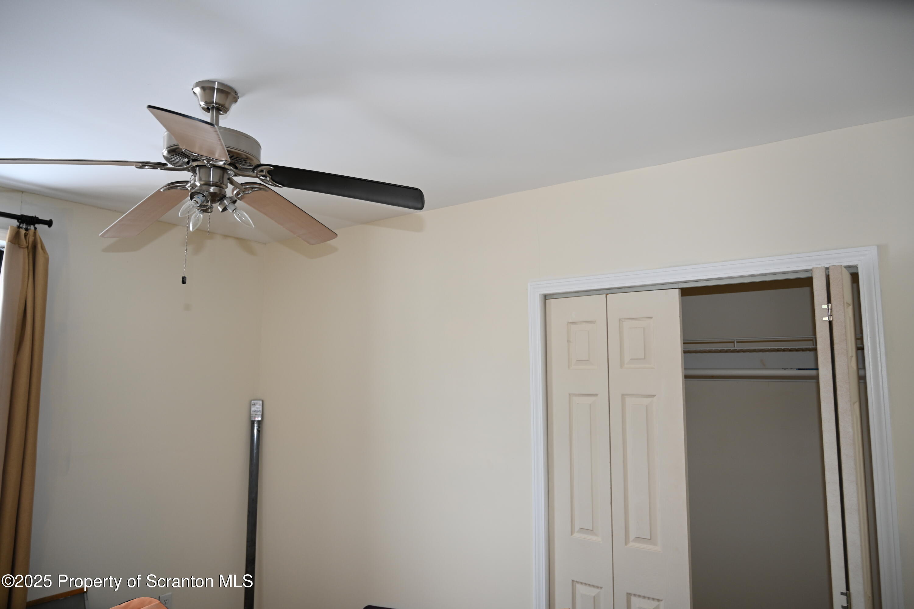 93 Prospect Street Hallstead, PA 18822 - Photo 23 of 32 a view of a room with a ceiling fan