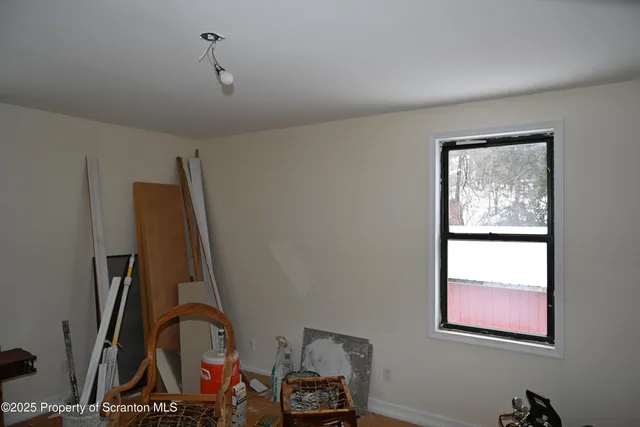 a room with gym equipment and large mirror