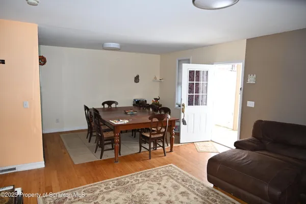 a living room with furniture a table and a window