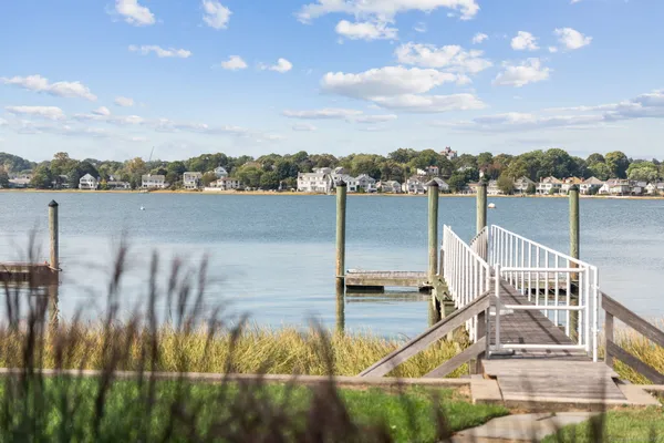 a view of a lake with a house in the background