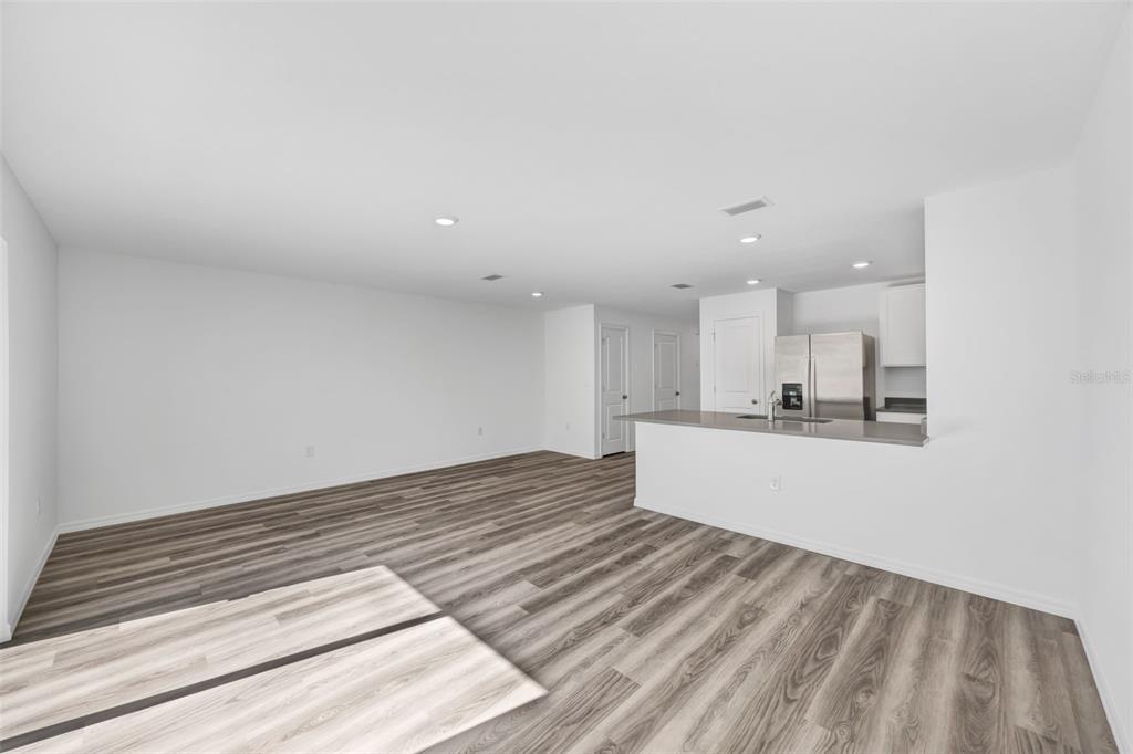 1009 Spotted Egret Loop Ruskin, FL 33570 - Photo 12 of 33 a view of kitchen and empty room