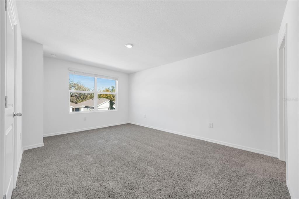 1009 Spotted Egret Loop Ruskin, FL 33570 - Photo 17 of 33 a view of an empty room and window